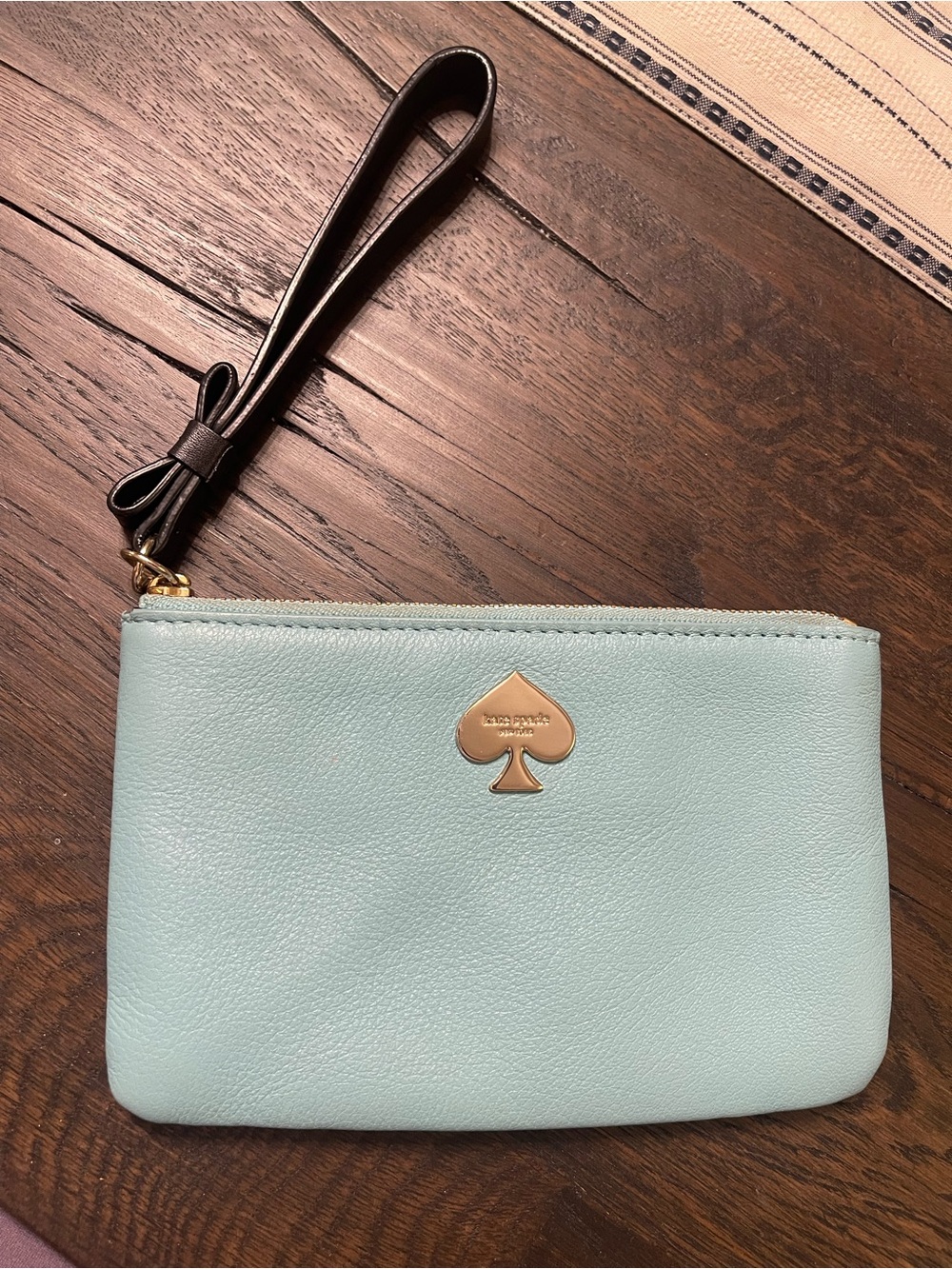 kate spade Mint Blue Leather Wristlet with Black Strap and Gold Logo